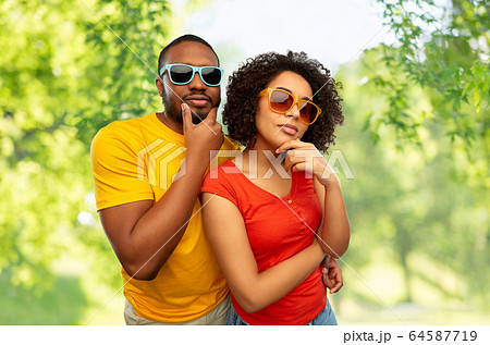 african couple in sunglasses thinking 64587719