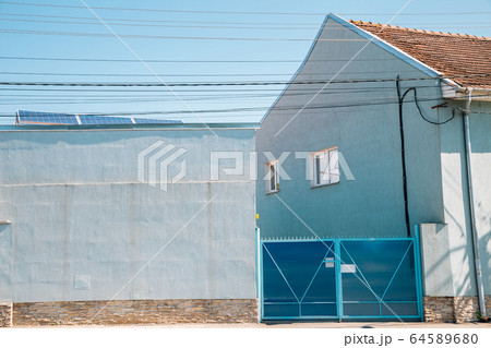 Blue house exterior in Hunedoara, Romania 64589680