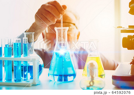 Scientist looking focus on new chemical vaccine formula successful to discover science research drug 64592076