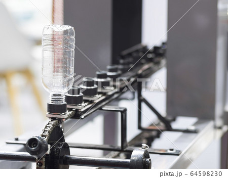 a platic bottle in shrink label machine ; a platic bottle in shrink label machine ; 64598230