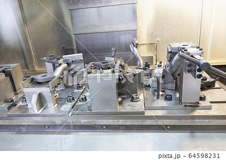 iron casting pipes were clamped on jig , ready for 64598231