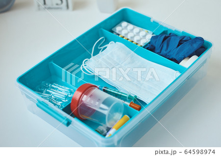 First aid kit close up. Home medicine box with a First aid kit close up. Home medicine box with a 64598974