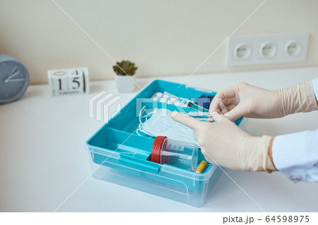 First aid kit close up. Home medicine box with a First aid kit close up. Home medicine box with a 64598975