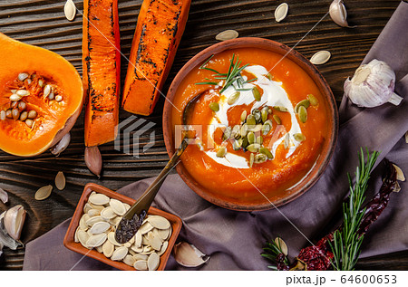 Flat lay view at homemade rustic pumpkin soup with Flat lay view at homemade rustic pumpkin soup with 64600653
