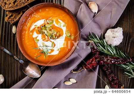 Flat lay view at homemade rustic pumpkin soup with Flat lay view at homemade rustic pumpkin soup with 64600654