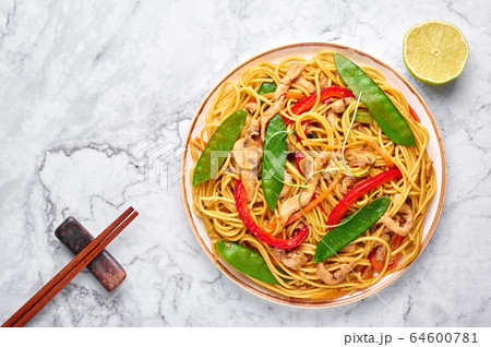 Chicken Lo Mein Noodles on white marble background. 64600781