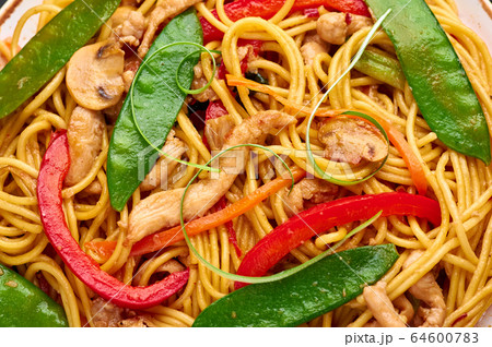 Chicken Lo Mein Noodles close up. Lo Mein is Chinese cuisine dish Chicken Lo Mein Noodles close up. Lo Mein is Chinese cuisine dish 64600783