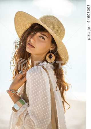 Woman Resting on the Beach During Vacation Woman Resting on the Beach During Vacation 64603003