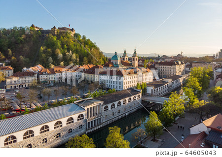 Aerial drone panoramic view of Ljubljana medieval city center, capital of Slovenia in warm afternoon sun. Empty streets during corona virus pandemic social distancing measures Aerial drone panoramic view of Ljubljana medieval city center, capital of Slovenia in warm afternoon sun. Empty streets during corona virus pandemic social distancing measures 64605043