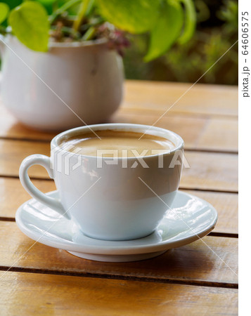 Hot coffee americano on the old wooden table 64606575