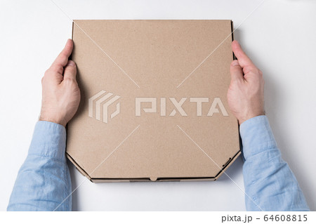 Box of pizza in male hands. White background. Box of pizza in male hands. White background. 64608815