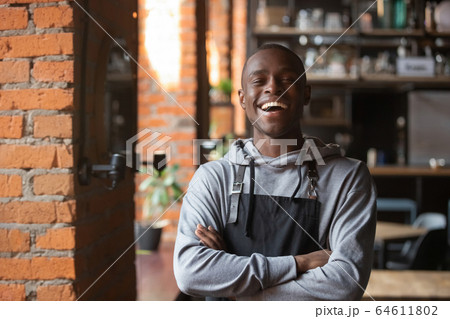 Happy confident african waiter small business owner portrait 64611802