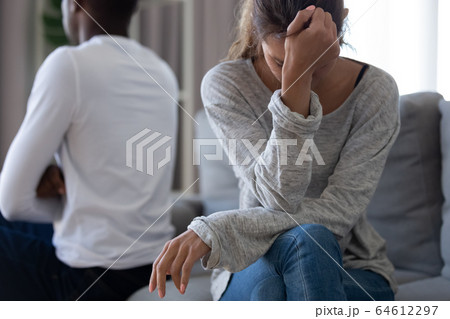 Sad unhappy woman wife turn back to black selfish husband 64612297