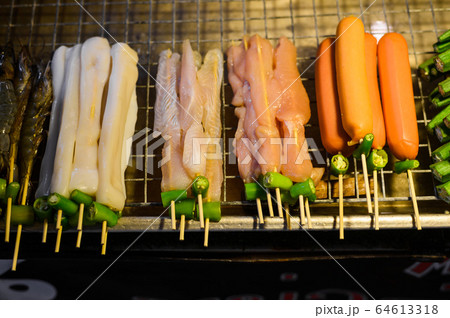 Skewers of grilled vegetables and meat in night market, thailand Skewers of grilled vegetables and meat in night market, thailand 64613318