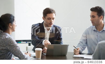 Serious businessman making online business project presentation at group negotiations 64613336