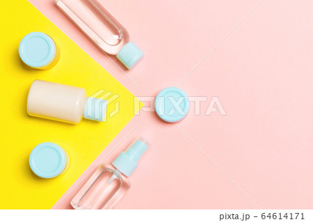 Top view of different cosmetic bottles and 64614171