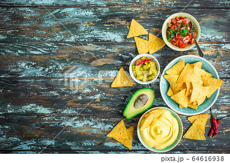 Tortilla chips and assorted dips Tortilla chips and assorted dips 64616938