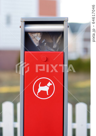 Red dispenser with bag for dog excrement sign Red dispenser with bag for dog excrement sign 64617046