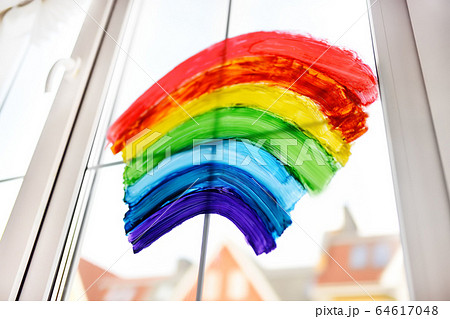 Drawing of rainbow on home window while quarantine Drawing of rainbow on home window while quarantine 64617048
