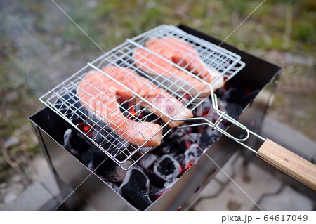 Cooking grilled red fish steak in the backyard. Cooking grilled red fish steak in the backyard. 64617049