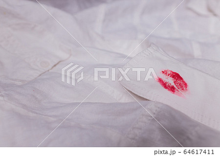 white man clothes stain lipstick mistress. close-up white man clothes stain lipstick mistress. close-up 64617411