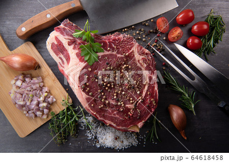 Raw T Bone steak entrecote prepared to Grill on turntable Raw T Bone steak entrecote prepared to Grill on turntable 64618458