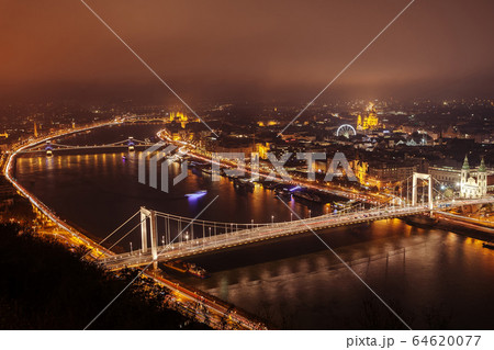 Panoramic view of evening Budapest from Gellert Hill. Panoramic view of evening Budapest from Gellert Hill. 64620077