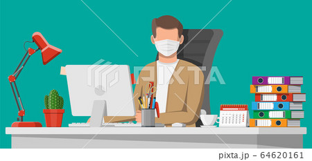 Man in medical mask working on his computer 64620161