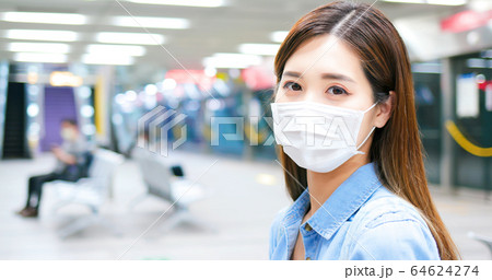 woman with mask in mrt woman with mask in mrt 64624274