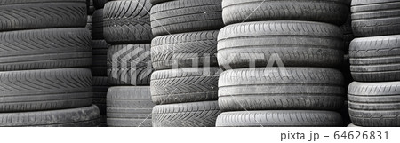 Old used tires stacked with high piles in Old used tires stacked with high piles in 64626831