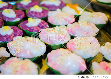 Thailand cup dessert made from Coconut milk topping with white sesame in Banana leaf cup. 64629699