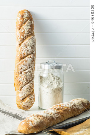 Fresh whole grain bread baguette. Fresh whole grain bread baguette. 64630209