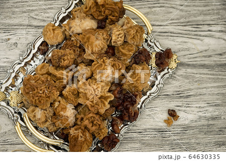 Gyromitra gigas, snow morel, on a tray, top view 64630335