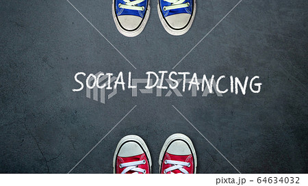 Social distancing. two people keep spaced between each other for social distance, increasing the physical space between people to avoid spreading illness during transmission of COVID-19 outbreak 64634032