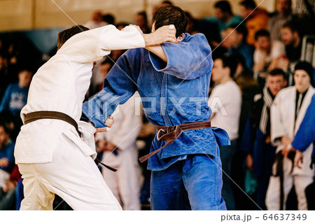 fight judokas on judo competition 64637349
