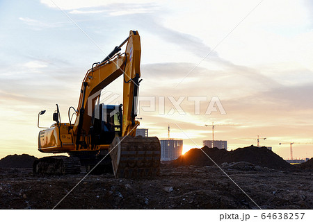 Large tracked excavator at a construction site  64638257