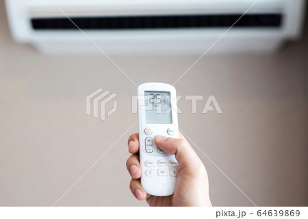 Air conditioner inside the room with close up man Air conditioner inside the room with close up man 64639869