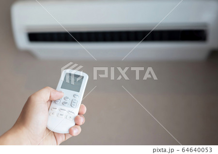 Air conditioner inside the room with close up man  64640053