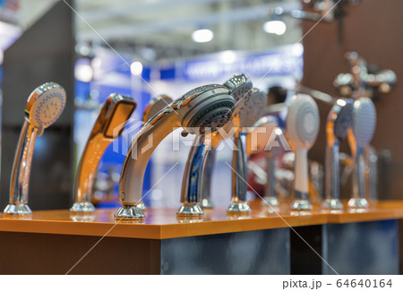 Shower heads on the stand in a hardware store Shower heads on the stand in a hardware store 64640164