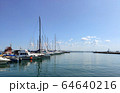 Wooden pier with many yachts stand and prepare for regatta, calm sea and small clouds in the sky 64640216