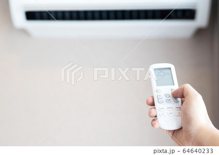 Air conditioner inside the room with close up man  64640233