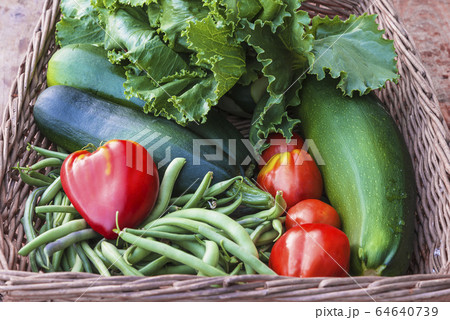 Fresh ripe vegetables in old wicker basket Fresh ripe vegetables in old wicker basket 64640739