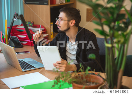 Caucasian entrepreneur, businessman, manager working concentrated in office 64645802