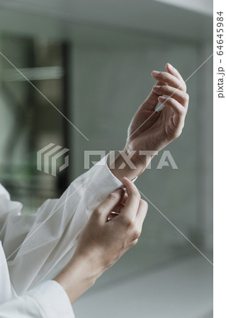 Cropped hand and sleeve. 64645984