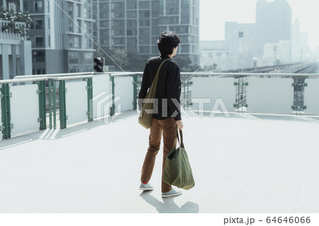 Man looking for a sky train. Man looking for a sky train. 64646066