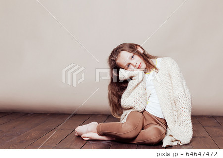 little girl sitting on the floor and sad little girl sitting on the floor and sad 64647472