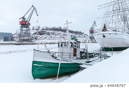 Vintage tug boat is moored in Turku at snowy Vintage tug boat is moored in Turku at snowy 64648767