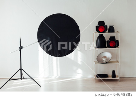 Photo studio flash equipment and accessories of a professional photographer 64648885