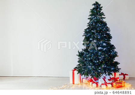 Christmas tree with lights garlands gifts decor of the house new year 64648891