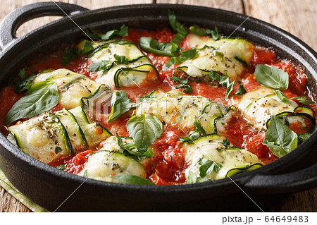 Italian cuisine zucchini rolls baked with ricotta Italian cuisine zucchini rolls baked with ricotta 64649483